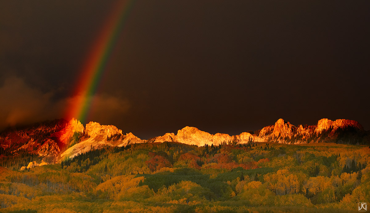 A brilliant rainbow appears above the Dyke formation of the Ruby Range one autumn evening near Kebler Pass.