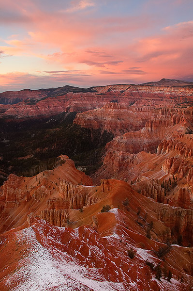 The colorful hoodoos of Cedar Breaks National Monument glow in the soft sunset light, while the clouds above absorb the last...