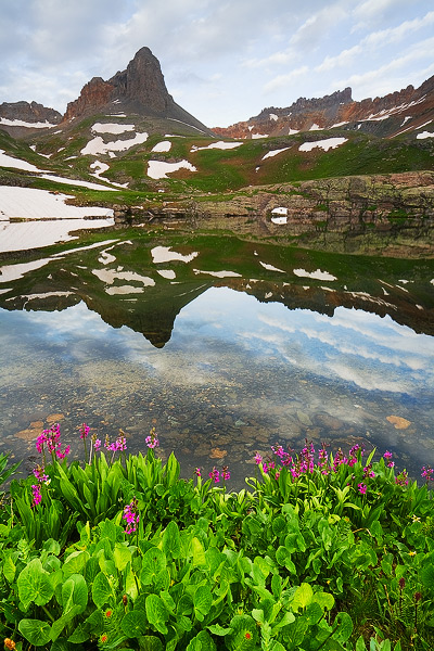 Golden Horn and Pilot Knob stand tall above their reflections in a small tarn in Upper Ice Lake Basin.