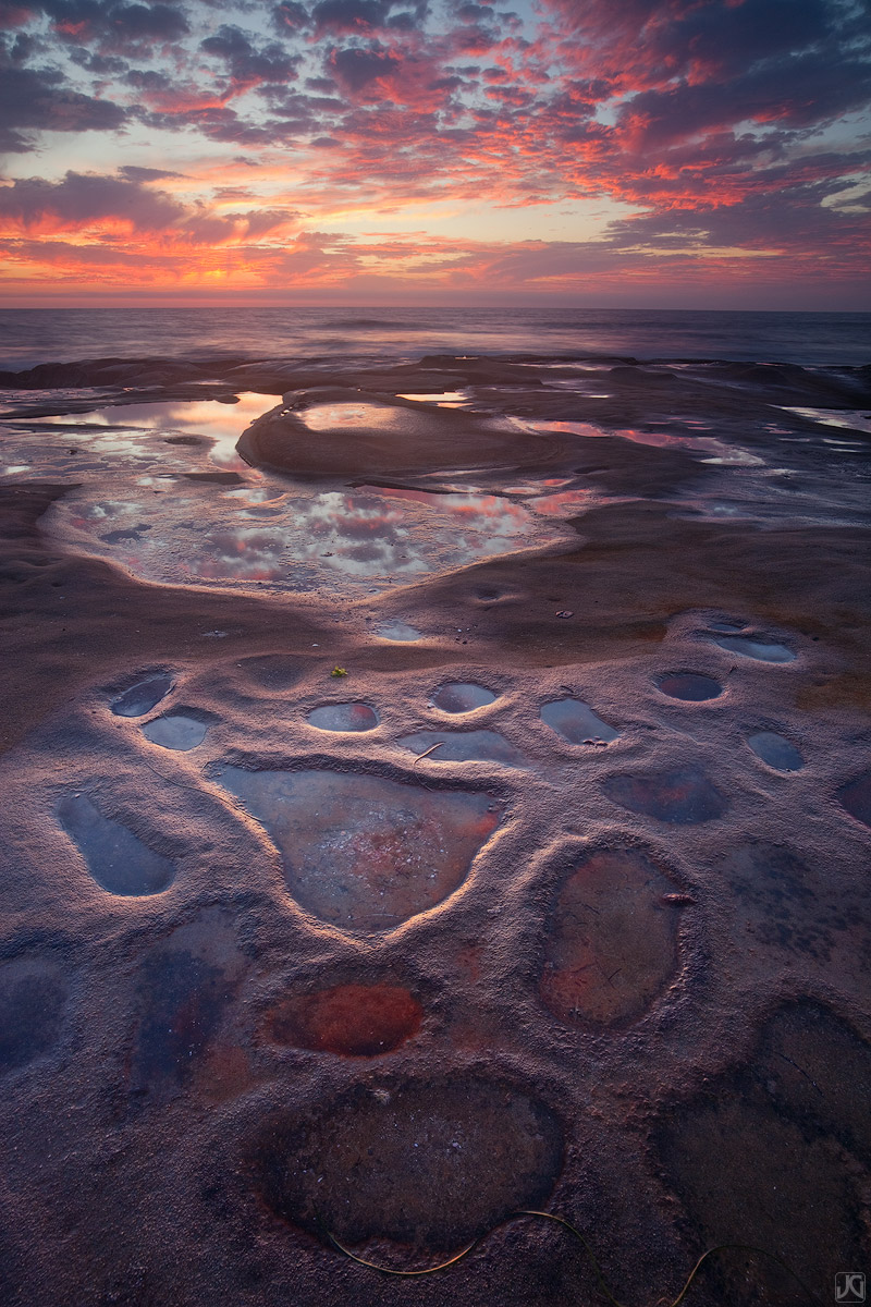 These unique beach formations in San Diego take on another life form when the sunset sky reflects on them.&nbsp;