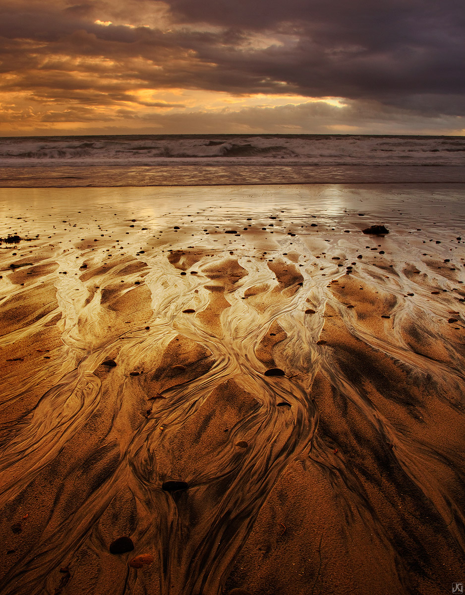 After a rainstorm, the water flows back across the beach and returns to the sea near Swamis in northern San Diego.&nbsp;