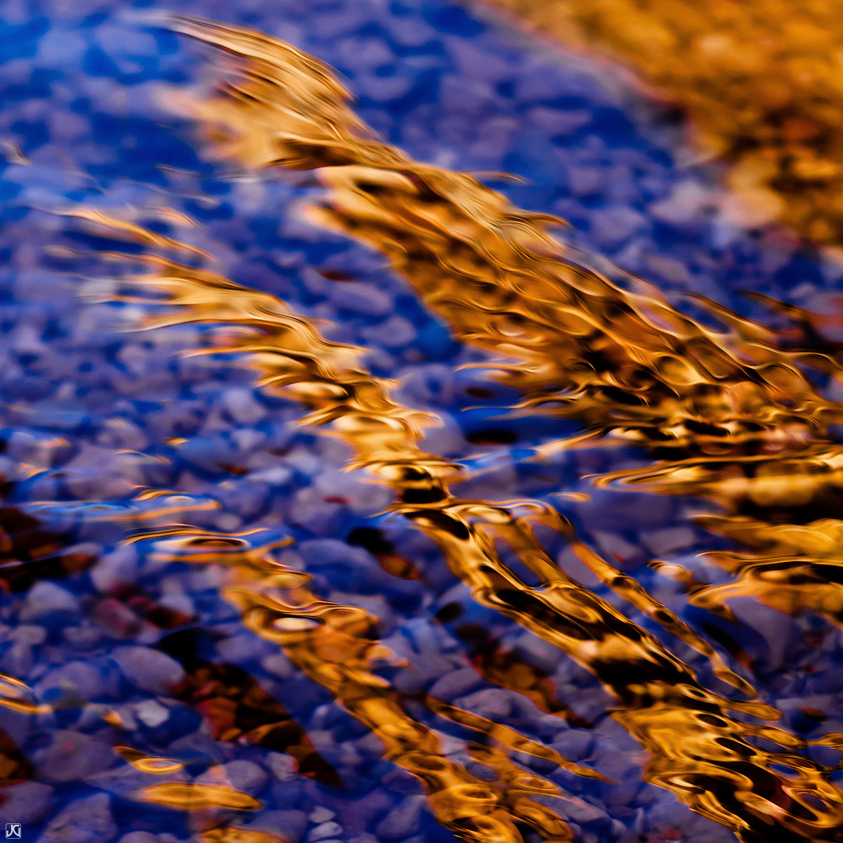 Reflections and ripples on Willis Creek, Utah.