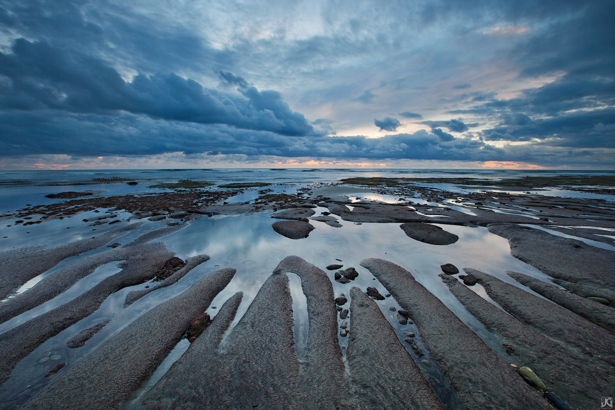 Low tide near along a beach in northern San Diego County, can sometimes reveal once hidden formations along the coast.&nbsp;