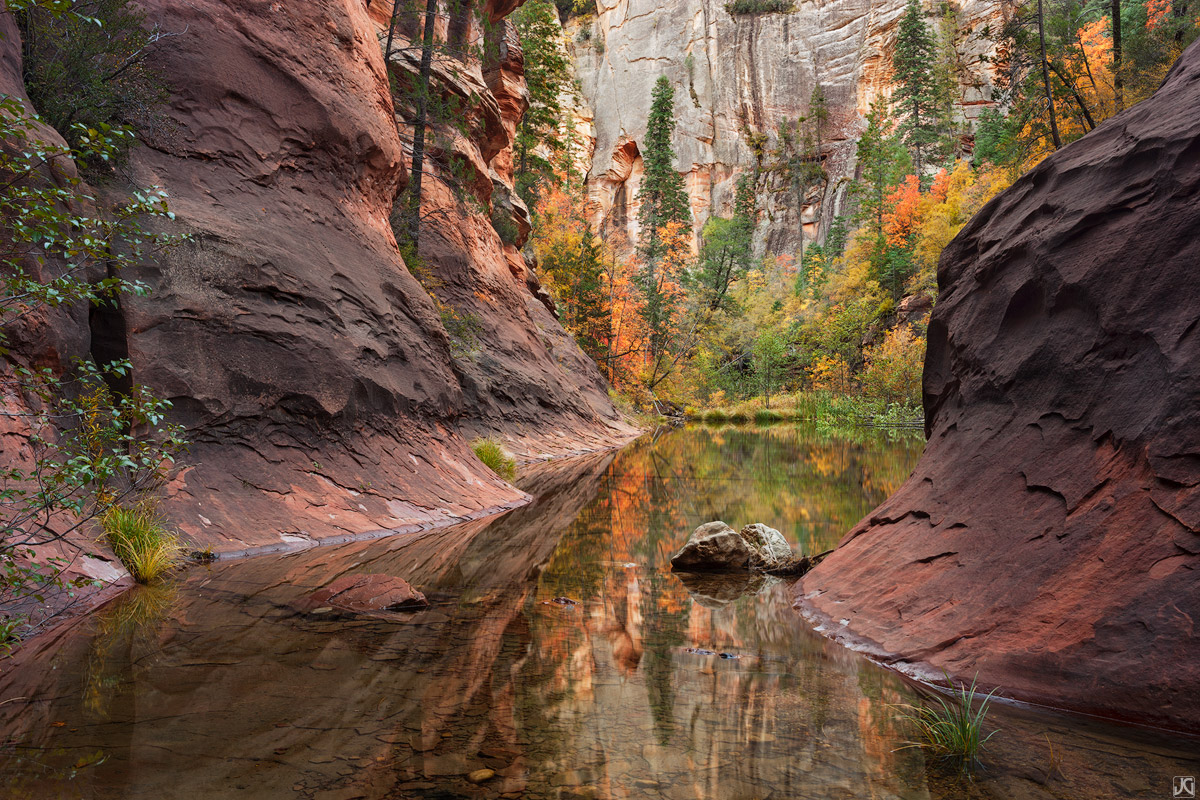 Fall colors reflect in this large pool of Oak Creek.