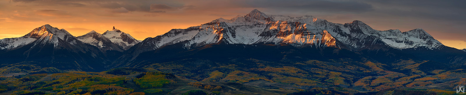 A late autumn sunrise lights up Mt. WIlson and the San Miguel Mountains, as the aspen forest below waits in shadow.