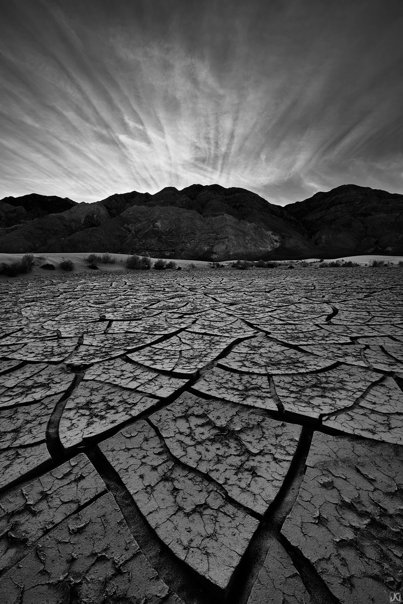 In the shadows of sunset rays lie a land of mud cracks, sand dunes, tiles and textures.