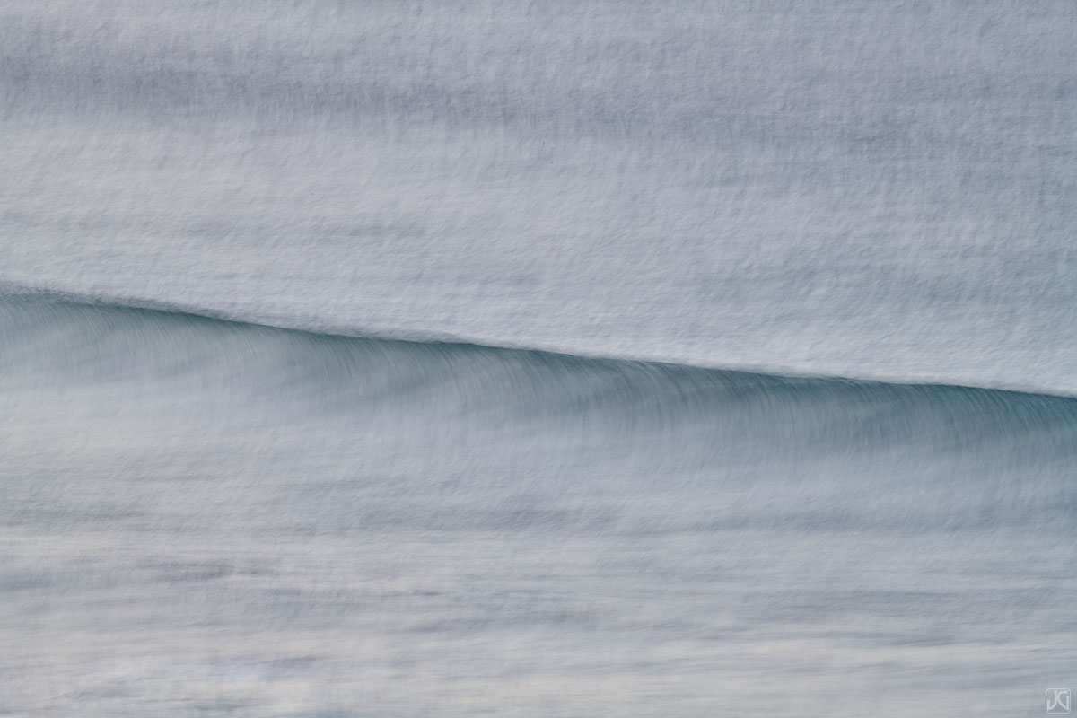 Incoming surf is rendered into a painterly effect.